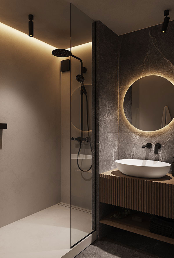 ترکیب نور سقفی، چراغهای نقطهای و نور مخفی پشت آینه در حمام عمق و جذابیت بصری ایجاد میکند